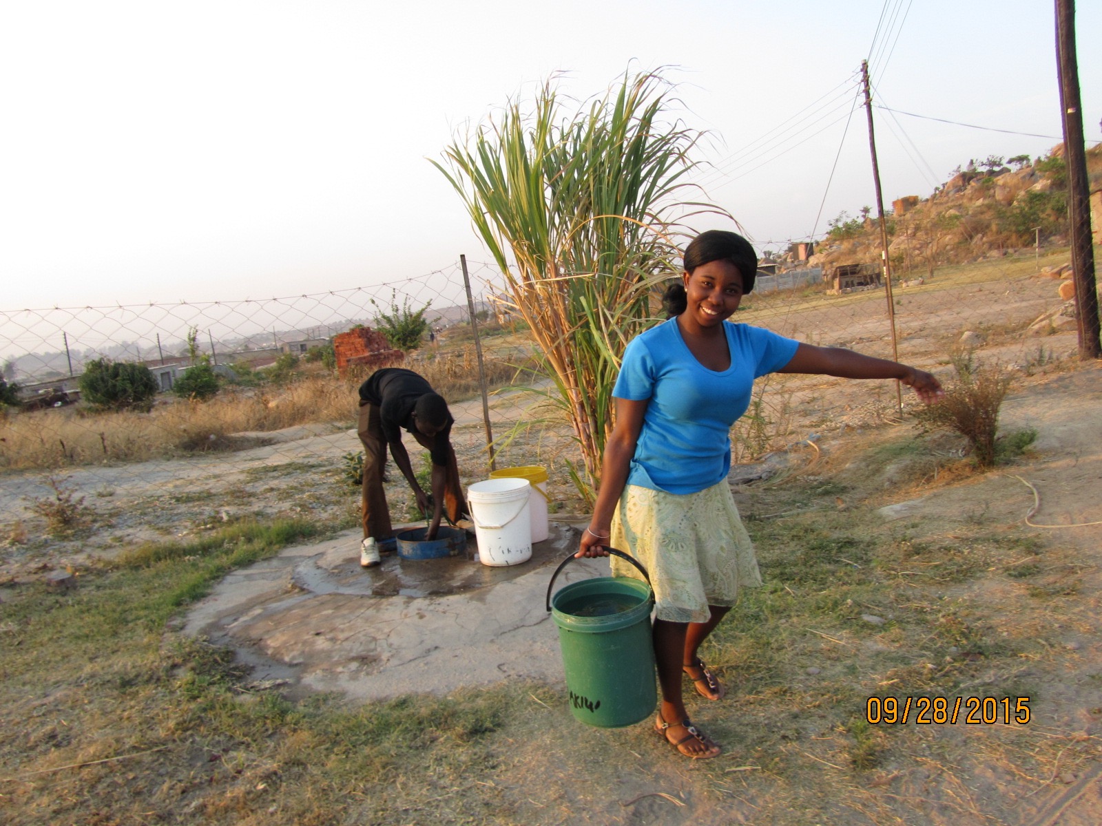 Sr. Claris’ niece Tafadzwa collects water from a well in Zimbabwe.