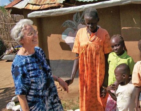 Maryknoll Sister Teresa Baldini with a family in Narus, South Sudan