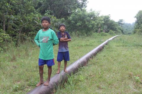 Children standing on Mongabay pipeline