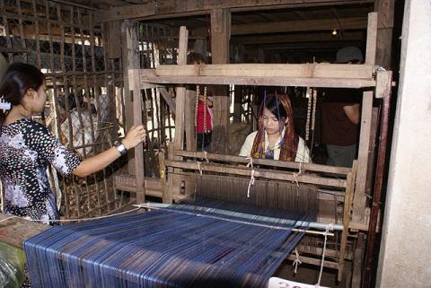 A woman at a weaving loom near Chau Doc, Vietnam