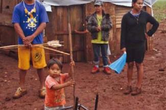 An indigenous family displaced from their land by the expansion of agribusiness in Mato Grosso do Sul, Brazil