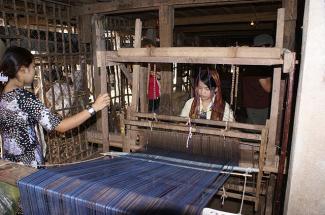 A woman at a weaving loom near Chau Doc, Vietnam