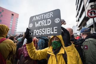 Another world is possible sign at protest on final day of COP26 Nov. 12. 2021 by LWF/Albin Hillert