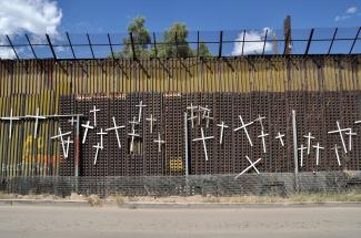 Crosses on border fence