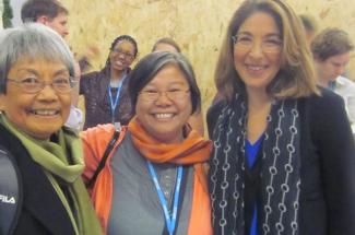 Maryknoll Sisters Becky Macugay and Marvie Misolas with Naomi Klein