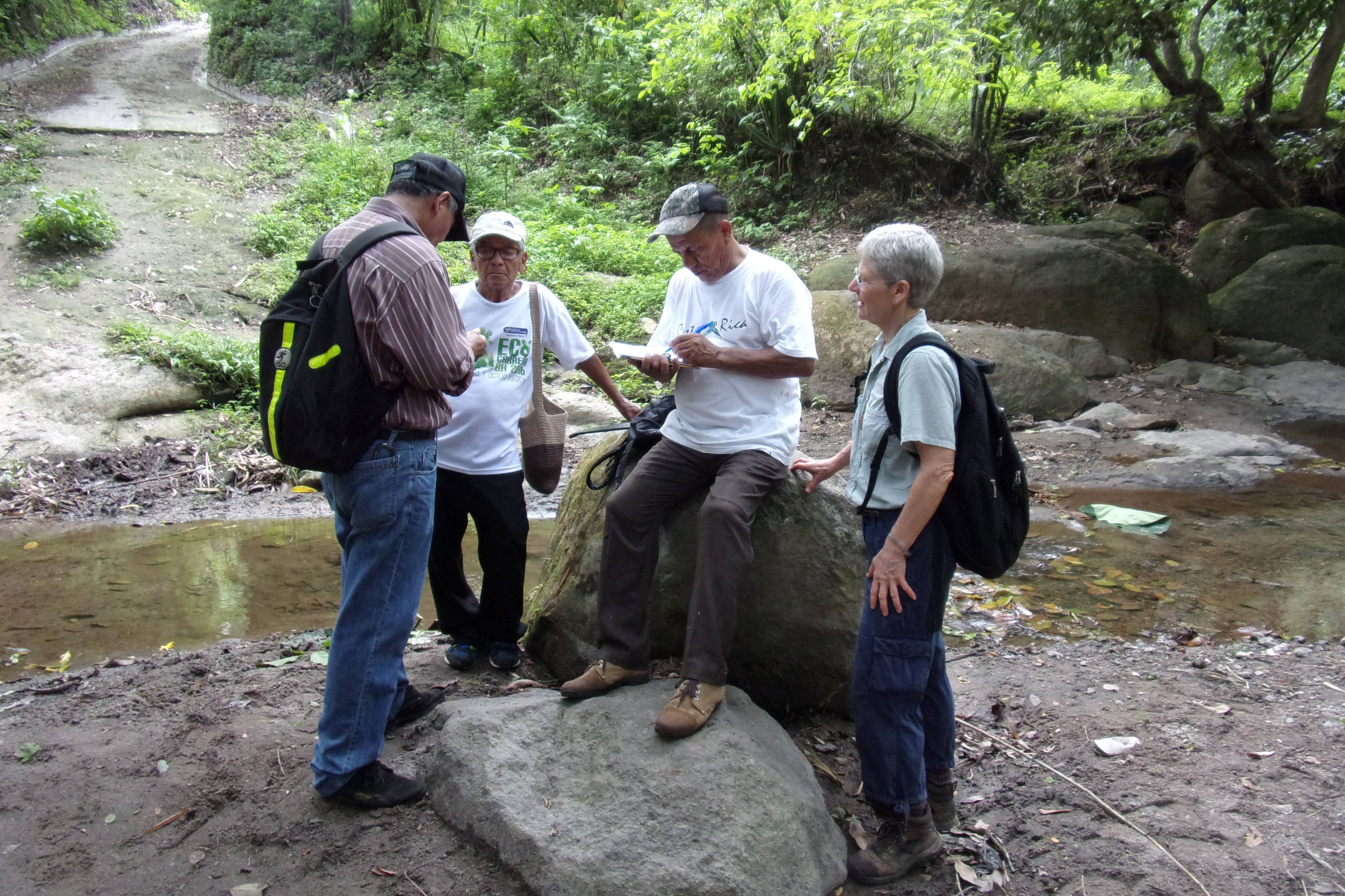 maryknoll_lay_missioner_peg_vamosy_collecting_data_with_other_watershed_sommittee_members_at_san_juan_river_el_salvador_2019_