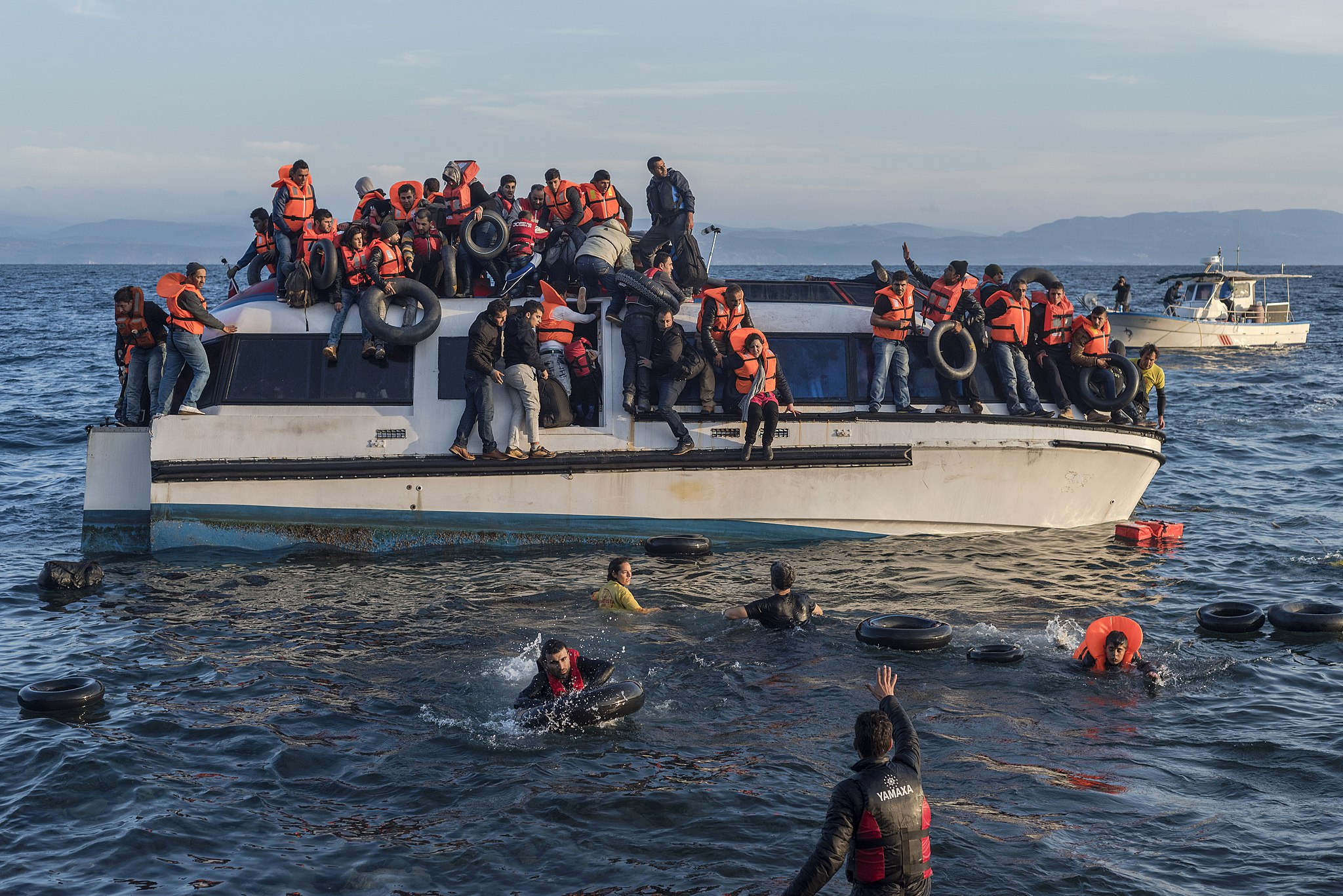 refugees_and_boat_lesbos_greece