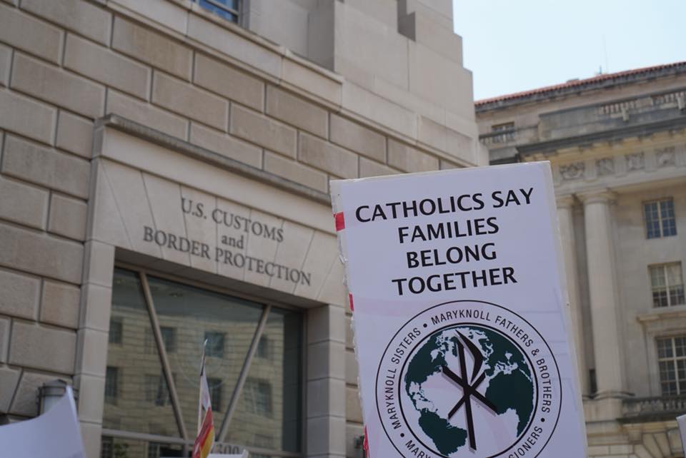 Catholics Say Families Belong Together sign at U.S. Customs and Border patrol in Washington, DC